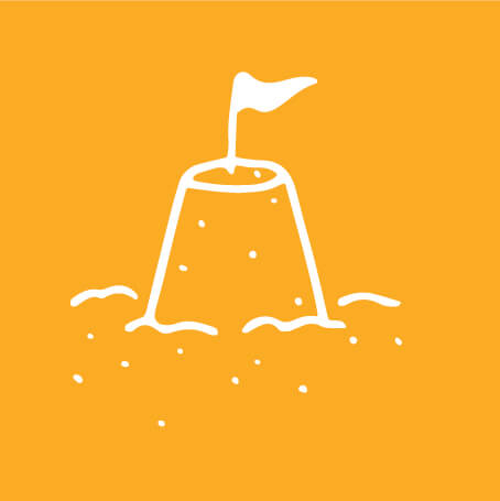yellow and white graphic of sand castle with flag sticking out