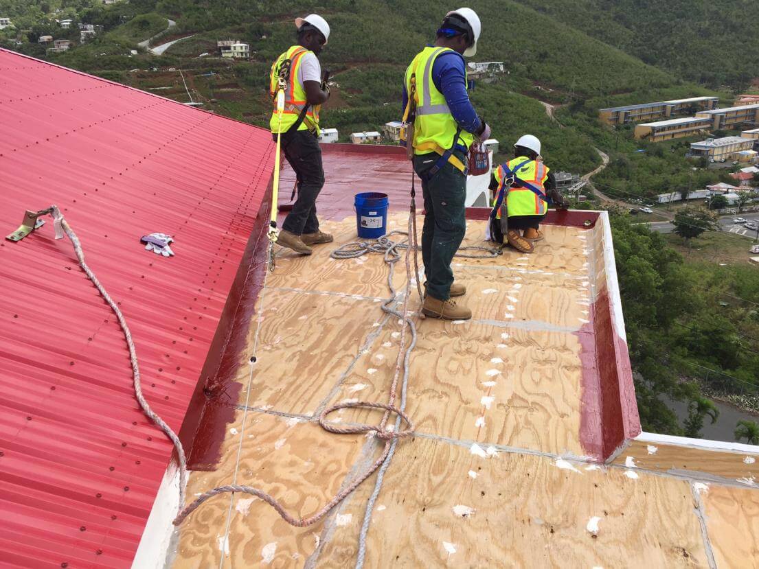 workers on the roof of the castle