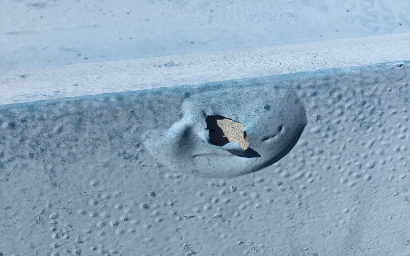 Concrete primer being applied on roof